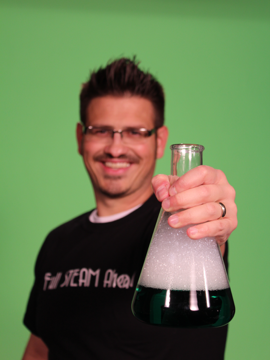 Mister C holding an erlynmeyer flask